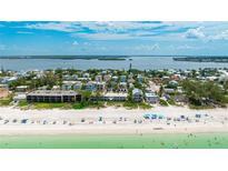 Gorgeous aerial view of beachfront condo with beach access and breathtaking gulf views at 2310 Gulf N Dr # 104, Bradenton Beach, FL 34217