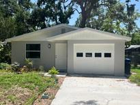 Charming single-story home with a one-car garage and well-maintained landscaping at 4740 Garcia Ave, Sarasota, FL 34233