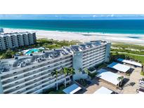 Aerial view of the building with beachfront access at 5750 Midnight Pass Rd # 203, Sarasota, FL 34242