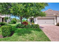 Charming single-Gathering home with lush green lawn and well-maintained landscaping at 1375 Backspin Dr, Englewood, FL 34223