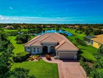 Beautiful single-story home with well-manicured lawn and a scenic pond view at 14714 5Th Ne Ter, Bradenton, FL 34212