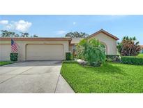 Charming single-story home with a well-manicured lawn and a two-car garage at 4198 Vallarta Ct # 3027, Sarasota, FL 34233