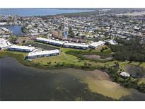 Waterfront condos with lush landscaping, ponds, and walking paths in a beautiful coastal community at 4832 Independence Dr, Bradenton, FL 34210