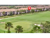 Scenic golf course view with lush green fairways and well-maintained landscaping surrounding the luxurious homes at 5528 Palmer Cir # 104, Bradenton, FL 34211