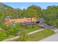 Stunning single story home with a metal roof and lush landscaping at 1112 Montezuma Dr, Bradenton, FL 34209