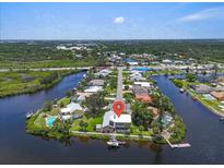 Waterfront home offers stunning aerial views and convenient access to the water and surrounding community at 1461 Marlin St, Nokomis, FL 34275