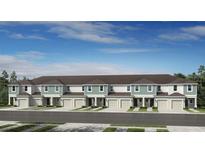 Charming townhome exterior featuring manicured lawns, attached garages, and a welcoming facade at 16652 Bergamo Pl, Bradenton, FL 34211