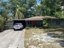 Charming single-story home with a quaint front yard and covered parking, perfect for comfortable living at 2115 Temple St, Sarasota, FL 34239