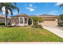 Charming single Gathering home featuring a manicured lawn and inviting curb appeal on a sunny day at 315 36Th Ne St, Bradenton, FL 34208