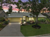 Charming single-story home with a well-manicured lawn, beautiful landscaping, and a welcoming entrance at 4733 Spring Meadow Ln, Sarasota, FL 34233