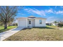 Charming one-story home featuring a well-manicured lawn, driveway, and a one car garage at 4796 Duncan Rd, Punta Gorda, FL 33982