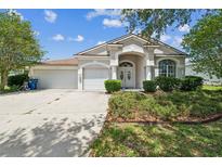 Charming single-story home featuring a well-manicured front yard and a two-car garage at 4915 Bookelia Cir, Bradenton, FL 34203