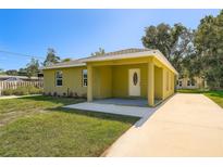 Charming single-story home with a well-manicured lawn and covered porch at 718 17Th E St, Bradenton, FL 34208