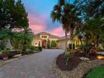 Stunning property with lush landscaping, beautiful brick drive and a tile roof at 12448 Highfield Cir, Lakewood Ranch, FL 34202