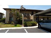 Inviting two-story condo featuring neat landscaping and covered parking for residents and guest parking available at 4016 Oakview Dr # J6, Punta Gorda, FL 33980