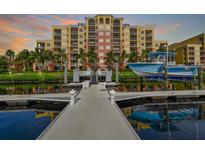 Stunning condo building with private boat dock and lift, perfect for waterfront living and easy access to boating at 610 Riviera Dunes Way # 306, Palmetto, FL 34221