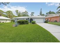 Charming single-story home featuring well-maintained landscaping and a concrete driveway at 1163 Nantucket Rd, Venice, FL 34293