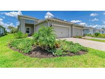 Charming single-story home with well-manicured landscaping and a two-car garage at 11685 Great Brook Ln, Parrish, FL 34219
