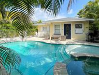 Inviting pool and spa surrounded by lush landscaping create a private backyard retreat at 152 Coolidge Dr, Sarasota, FL 34236