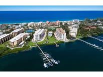 Coastal condo community offering a serene beachside living experience with a private boat dock at 8735 Midnight Pass Rd # 602B, Sarasota, FL 34242