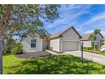 Charming single-Gathering home featuring manicured lawn and a two-car garage at 1107 22Nd E St, Palmetto, FL 34221