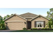 Charming single-story home with a two-car garage, neutral stucco facade and landscaped front yard at 12068 Mountain Island Trl, Parrish, FL 34219