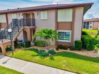 Charming two-story condo with well-maintained landscaping and a private entrance at 25100 Sandhill Blvd # 104 G, Punta Gorda, FL 33983