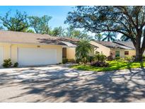 Charming villa with a well-manicured lawn and a two-car garage, perfect for easy living at 4279 Oakhurst E Cir # 3044, Sarasota, FL 34233
