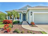 Charming single-story home with well-maintained landscaping and inviting curb appeal on a sunny day at 5333 Tide Point Way, Bradenton, FL 34208