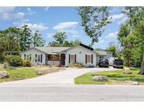 Charming single-story home with a stone-lined driveway and well-maintained landscaping at 9007 63Rd Avenue E Dr, Bradenton, FL 34202