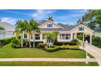 Charming single-Gathering home with beautiful landscaping, mature palms and a carport at 4727 Starboard Dr, Bradenton, FL 34208