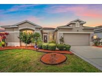 Charming single-Gathering home featuring manicured landscaping and a well-maintained lawn at 6266 Buckingham St, Sarasota, FL 34238