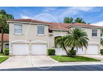 Charming townhome featuring a well-manicured lawn and a classic red tile roof at 7137 Cedar Hollow Cir, Bradenton, FL 34203