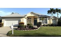 Charming single Gathering home featuring well-manicured lawn and two-car garage at 8616 15Th Nw Ave, Bradenton, FL 34209