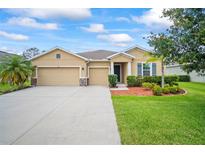 Charming single-story home featuring a well-manicured lawn and a spacious three-car garage at 226 Tapa Parish Run, Bradenton, FL 34212
