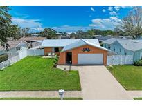 Charming single-Gathering home with a well-maintained lawn, white picket fence, and a one-car garage at 2406 15Th W St, Palmetto, FL 34221