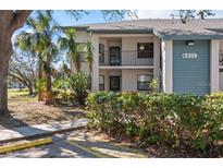Well-maintained two-story condo building featuring lush landscaping and visible unit number at 4411 46Th W Ave # 201, Bradenton, FL 34210
