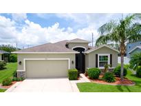 Well maintained home with mature landscaping, a two car garage, and neutral color palette at 7364 47Th Avenue E Cir, Bradenton, FL 34203