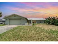 Charming one-story home with a two-car garage and a well-maintained lawn, perfect for suburban living at 2919 Shannon Drive, Punta Gorda, FL 33950