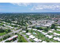 An aerial view shows the community's layout with well-maintained landscaping and convenient access to the city at 3641 Somerville Dr # 1506, Sarasota, FL 34232
