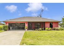 Charming single-story home with a well-manicured lawn and a spacious driveway at 4145 W Price Blvd, North Port, FL 34286
