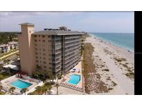 Expansive coastal condominium with multiple pools and beach access, offering luxurious waterfront living at 555 The Esplanade N # 202, Venice, FL 34285