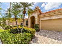 Charming single-story home featuring manicured landscaping and a neutral color palette at 5179 Cantabria Crst, Sarasota, FL 34238