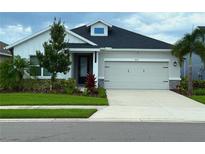 Charming single-Gathering home featuring a two-car garage and well-maintained landscaping at 8706 Arrow Creek Dr, Parrish, FL 34219