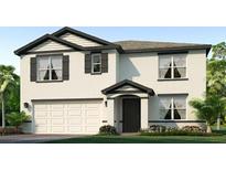 Inviting two-story home featuring a two-car garage and charming architectural details at 12063 Mountain Island Trl, Parrish, FL 34219