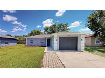 Charming single-story home with a well-maintained lawn and a one-car garage at 1707 24Th E St, Palmetto, FL 34221