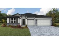 Charming single-story home with a three-car garage and stone accents at 17146 James Trl, Parrish, FL 34219