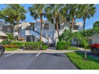 Multi-Gathering building with tropical landscaping, palm trees, and parking spots at 548 Lakeside Dr # 0, Bradenton, FL 34210