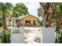 Charming home with a welcoming front porch and stylish desert landscaping at 2189 Hillview St, Sarasota, FL 34239