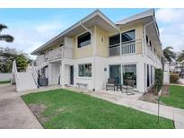 Inviting two-story condo with a charming balcony and well-maintained lawn at 999 Inlet Cir # 103, Venice, FL 34285
